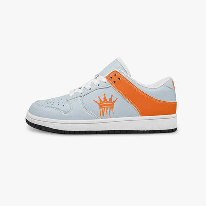 a white and orange shoe with a crown on it